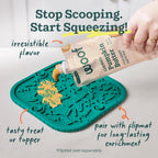 Pet parent applying the grain free pumpkin and peanut butter topper onto an interactive puppy toy.