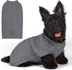 A large dog comfortably walking outdoors at dusk wearing the reflective sweater.