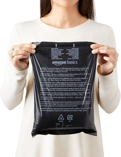 Amazon Basics large leak proof dog bags showing the thirteen by nine inch dimensions.