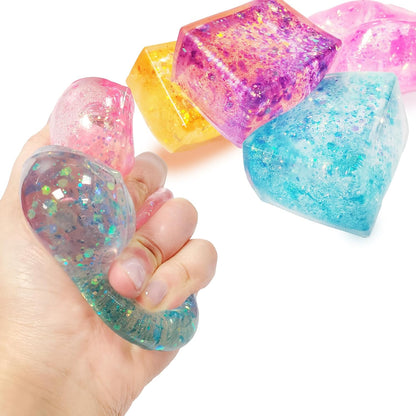 Glow Fever Glitter Ice Cubes front view of four colorful squishy stress balls