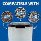 The Pond Guy solar fish feeder broadcasting food pellets over a large garden pond.