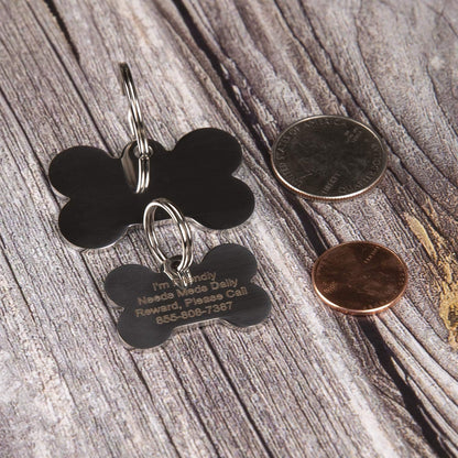 PetANTastic personalized bone shaped dog tag attached to a collar.