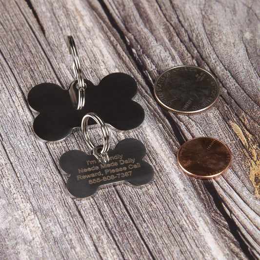 PetANTastic personalized bone shaped dog tag attached to a collar.