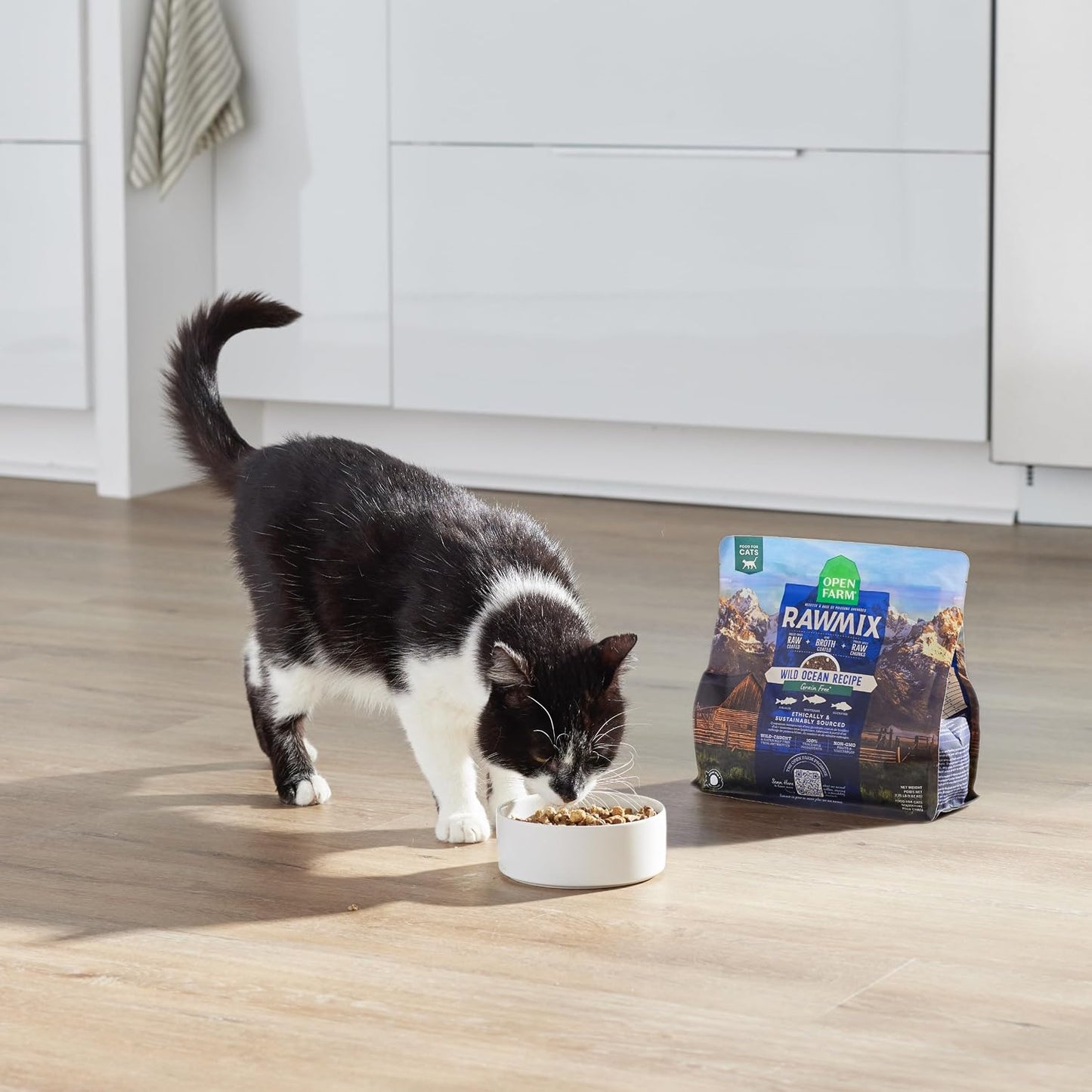 Open Farm chicken and turkey cat food bag standing upright in a clean pet pantry setting