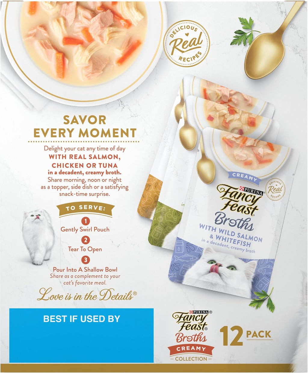 Lifestyle shot of cat food pouches displayed alongside bowls and ingredients.
