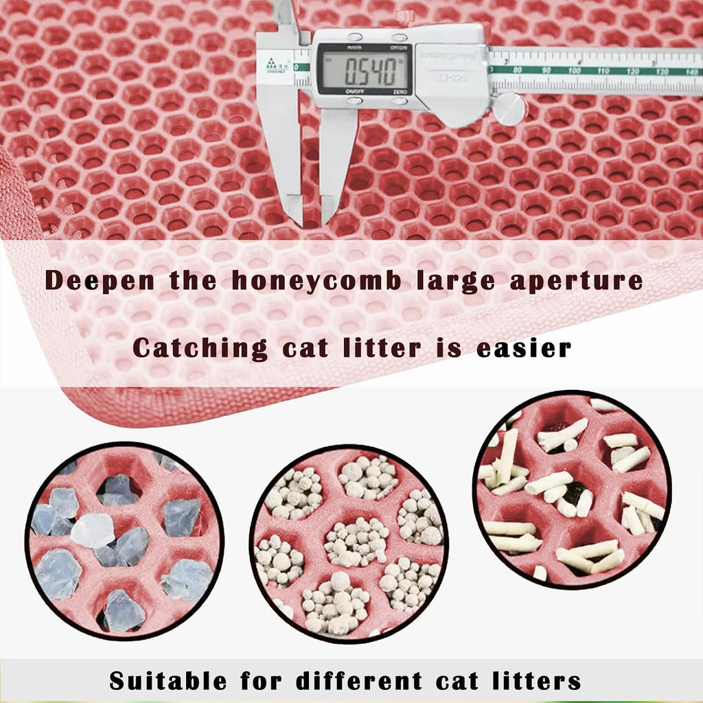 A domestic cat stepping onto the soft pink EVA foam litter trapping mat.