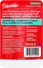 Cat eating dry food enhanced with Delectables food topper