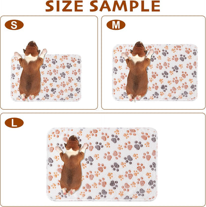 Three pack of Yintrest flannel dog blankets spread out on a living room sofa.