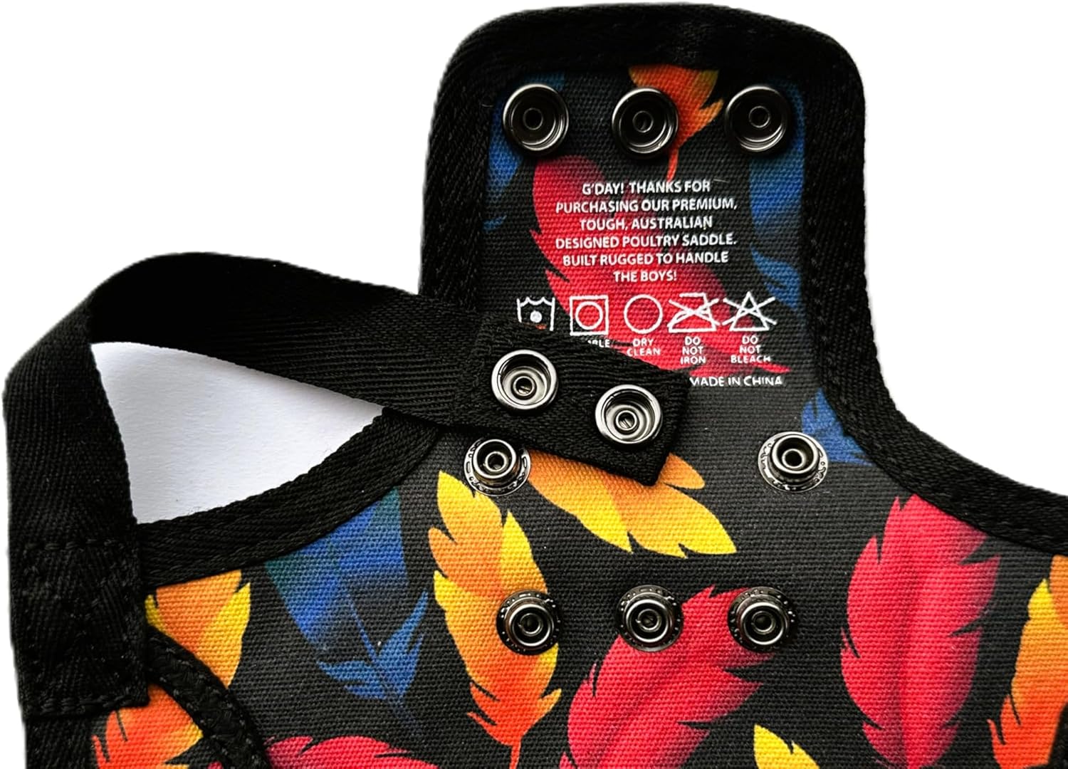 Durable poultry saver chicken saddle with integrated shoulder cover protection.