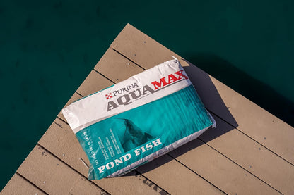 Purina AquaMax floating fish food pellets close up