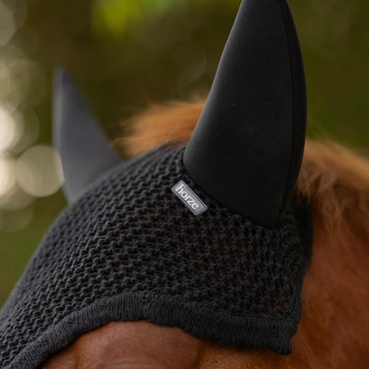 Close up of hand-knitted crochet horse ear bonnet