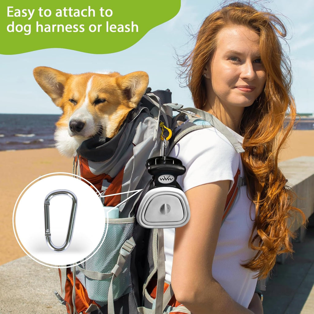 SuperDesign compact travel pooper scooper attached to a leash with carabiner