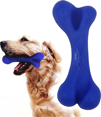 Dog playing with blue tough tug-of-war disc on grass