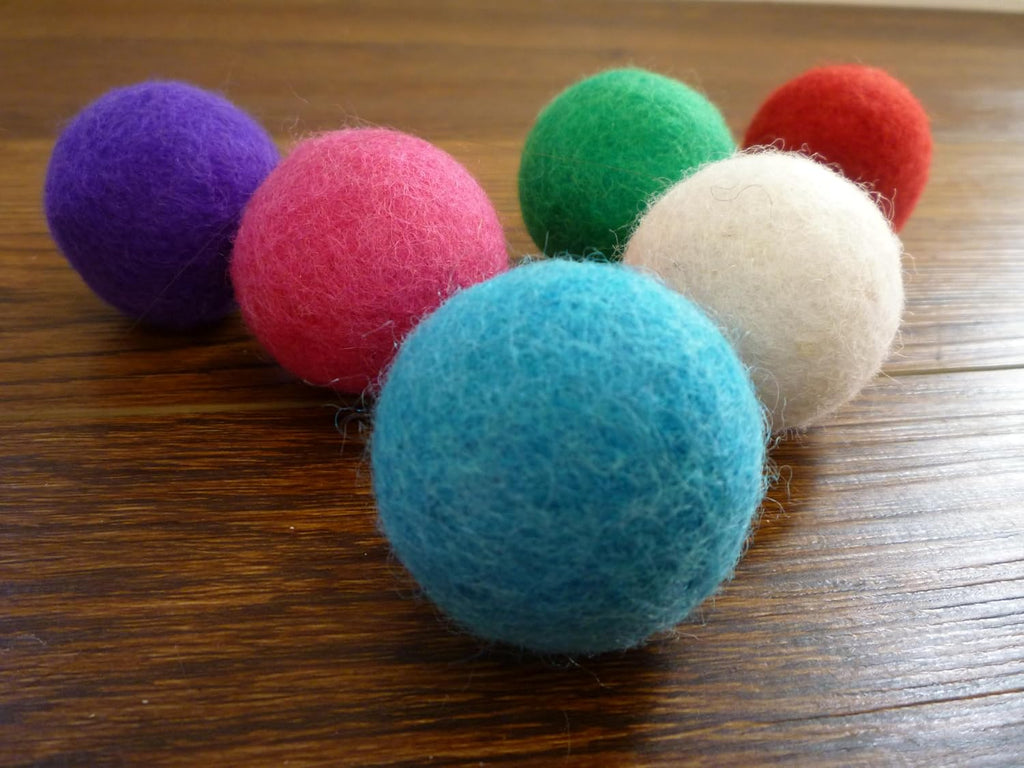 Close up of handmade felt wool balls for cats and kittens