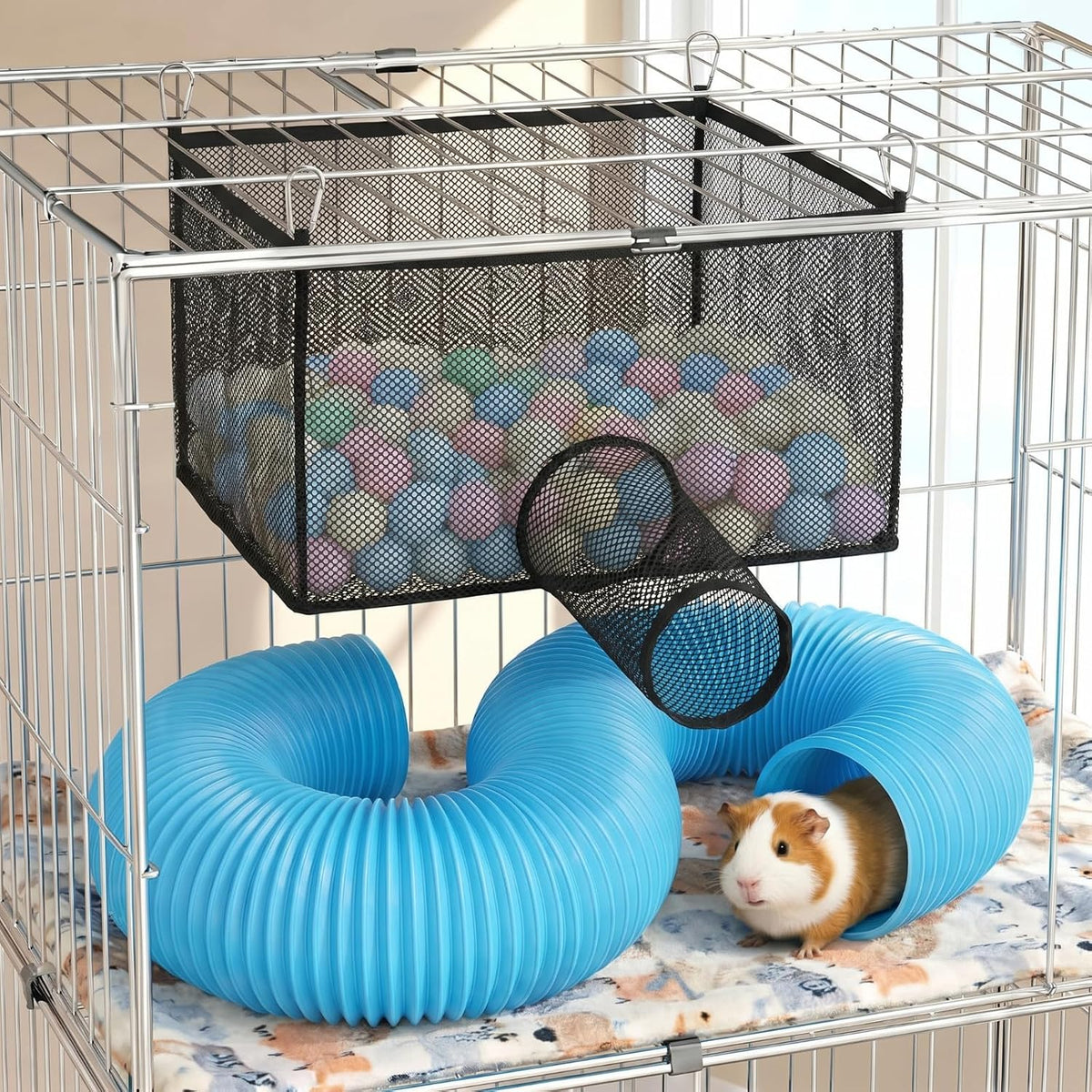 Mifoci ferret ball hammock with tunnel front view suspended inside a small animal wire cage.