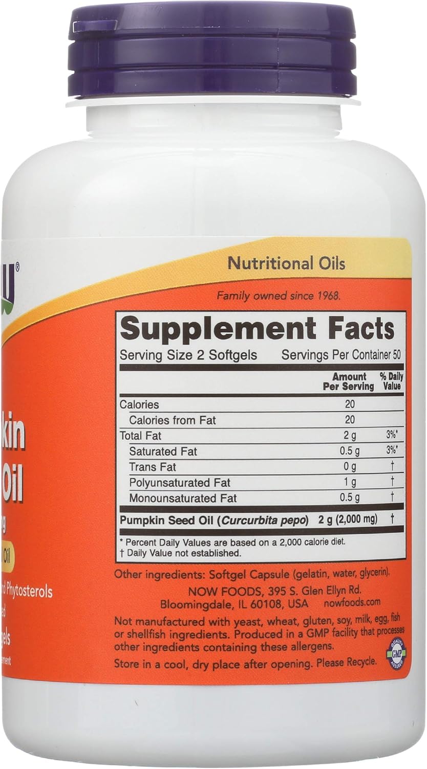 Close up of NOW Foods pumpkin seed oil softgels next to its orange and white packaging.