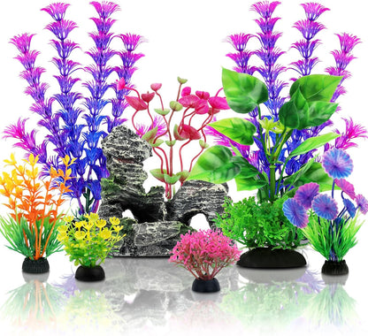 QUOZUO fish tank accessories set front view featuring colorful artificial plants and a resin cave rock.