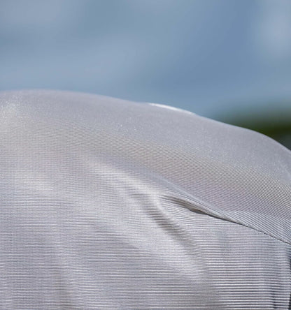 Close-up view of the breathable mesh weave and adjustable crossed surcingles on the Amigo horse protective blanket