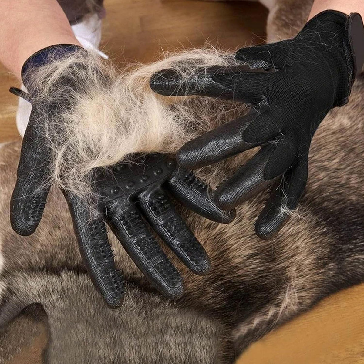 User wearing Lumova pet grooming glove on hand