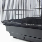 KFPPLXQ black bird cage guard installed on a large square parrot cage preventing food splash.