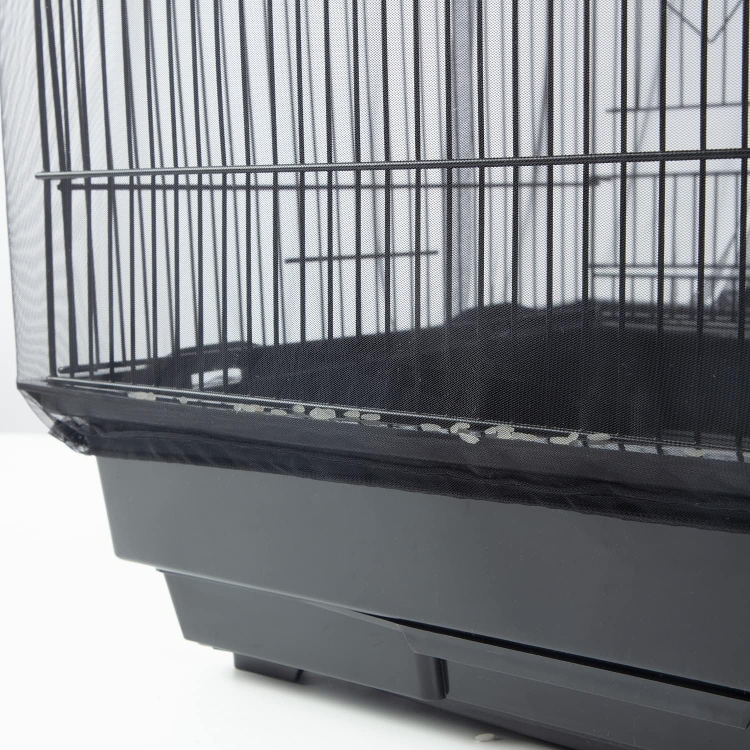 KFPPLXQ black bird cage guard installed on a large square parrot cage preventing food splash.