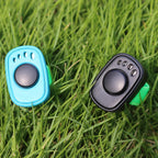 OYEFLY HoAoOo finger ring clicker being worn on a hand during a dog obedience session