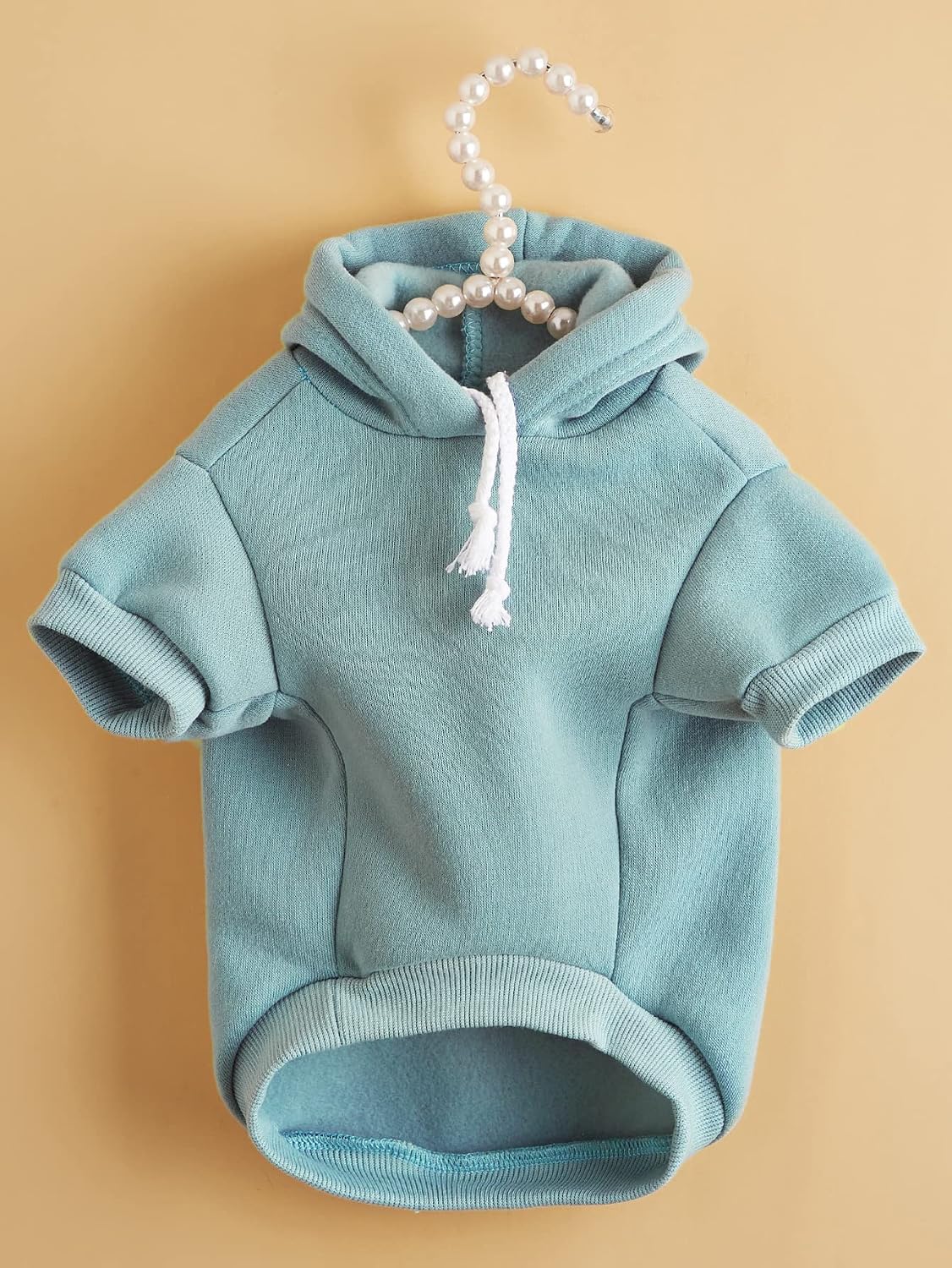 QWINEE cat clothes displaying the stretchy pullover fabric texture