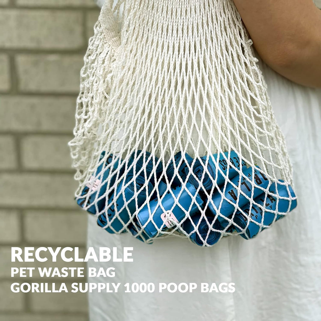 Blue dog waste bags attached to a leash using the convenient bone dispenser tie.