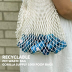 Blue dog waste bags attached to a leash using the convenient bone dispenser tie.