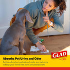 Glad For Pets puppy pads inside a dog crate illustrating indoor training applications.