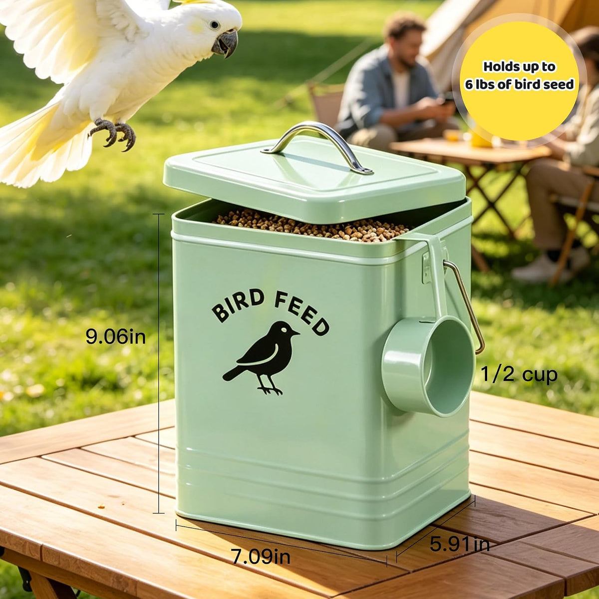 Candco metal bird feed storage bin with dual wooden handles.