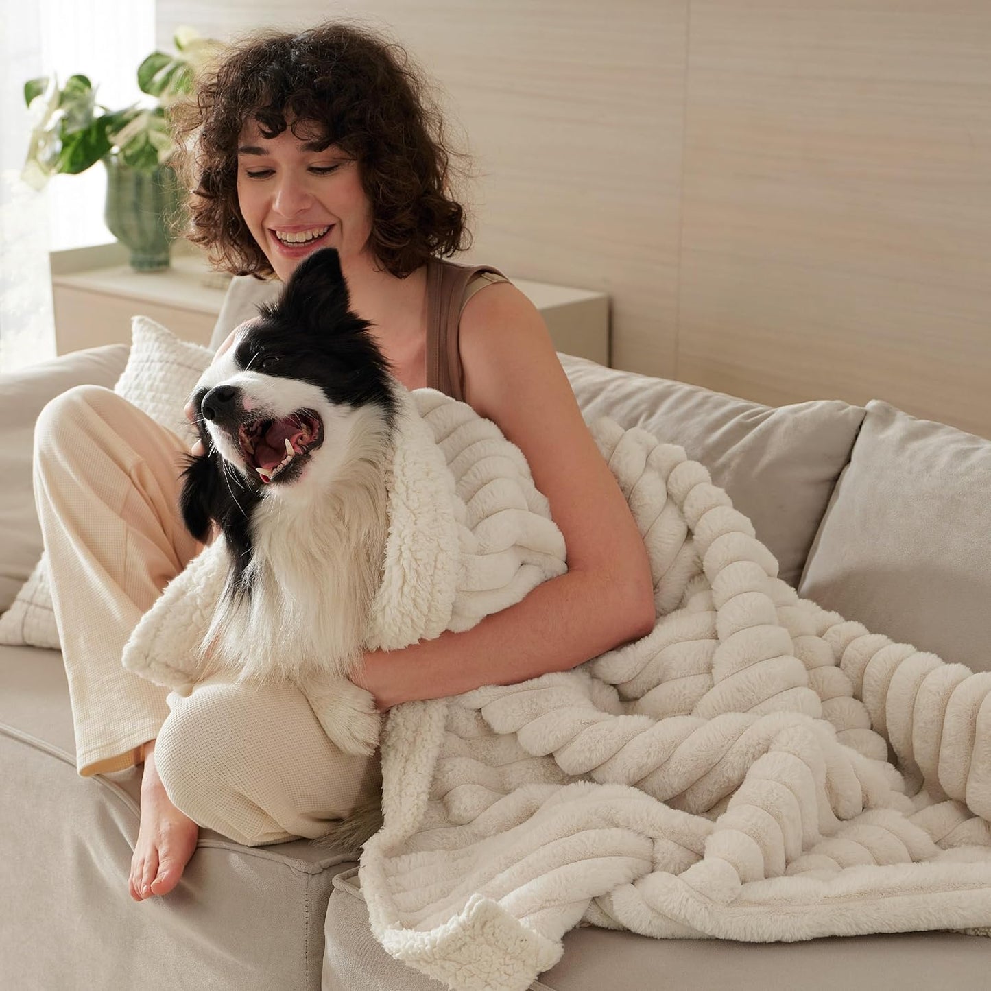Close up view of the cream colored ribbed corduroy texture on the pet throw