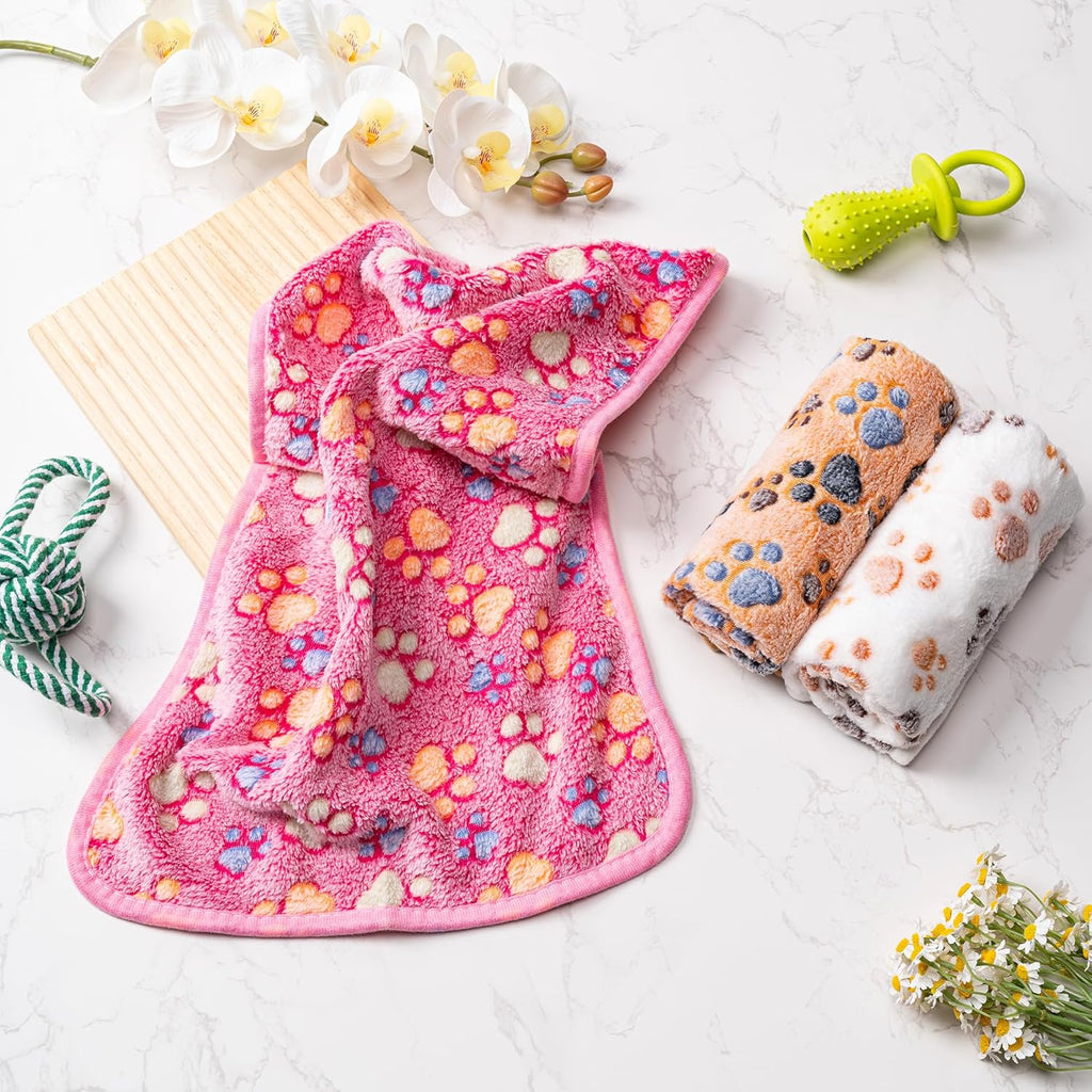 Yintrest premium pet blanket being placed inside a standard plastic pet carrier for travel.