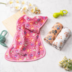 Yintrest premium pet blanket being placed inside a standard plastic pet carrier for travel.