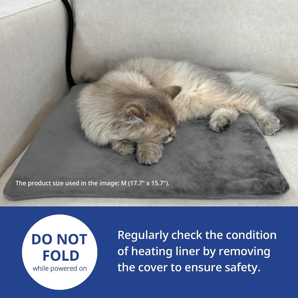 NICREW electric pet heating mat with grey fleece cover on a living room floor
