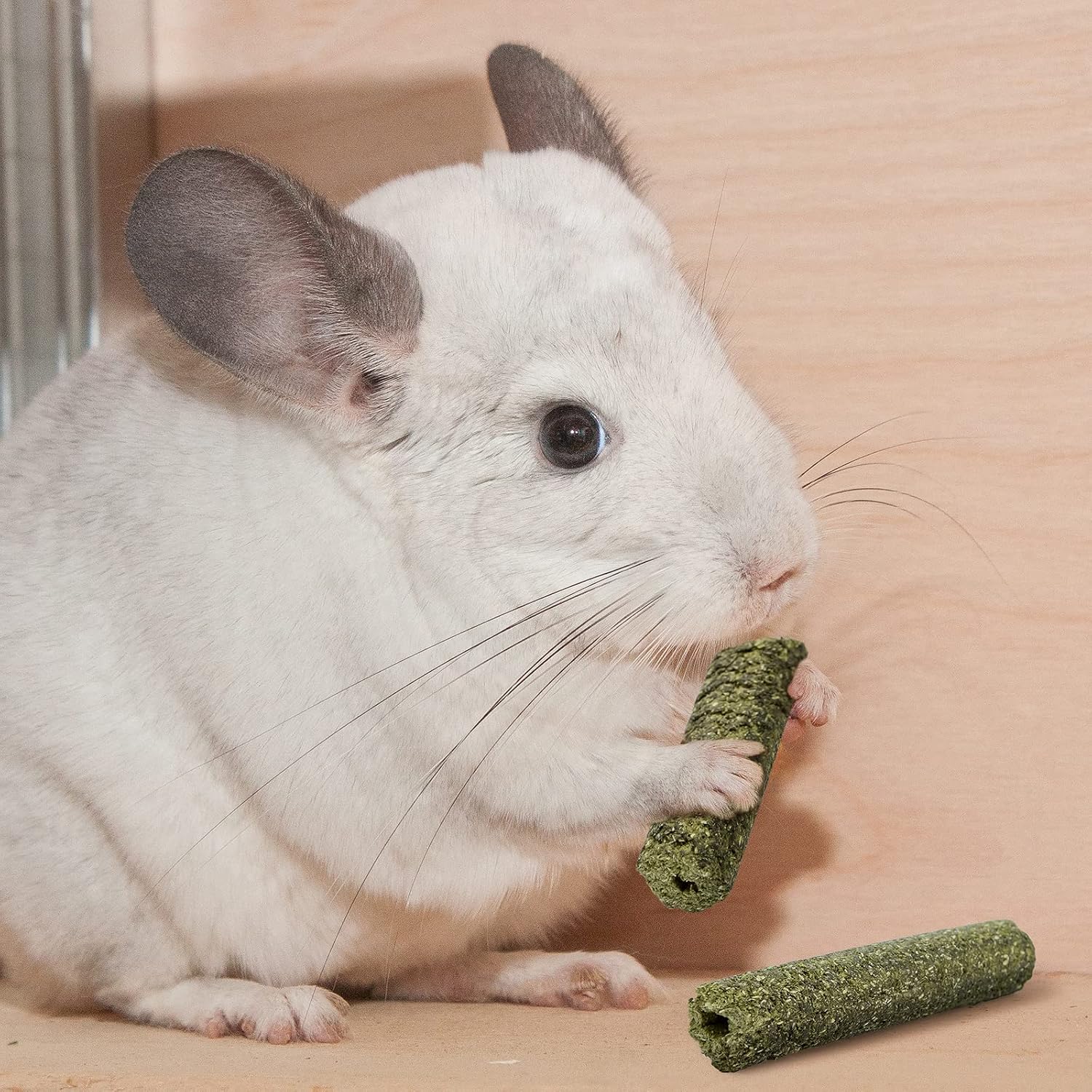 Compressed green timothy hay chew sticks close up