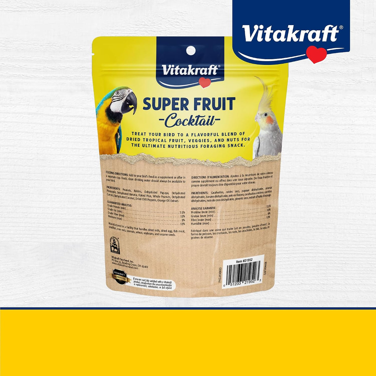 Hand holding Vitakraft bird treat for training purposes