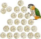 Hand holding natural sola ball toy for bird safety demonstration
