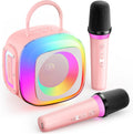 SunTrok mini karaoke machine front view showing pink portable speaker and dual wireless microphones