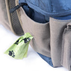Close up of dog backpack harness buckle closure and side pockets