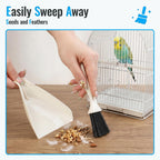 SIMPOR mini dustpan and hand brush sweeping up loose bird seeds and feathers.