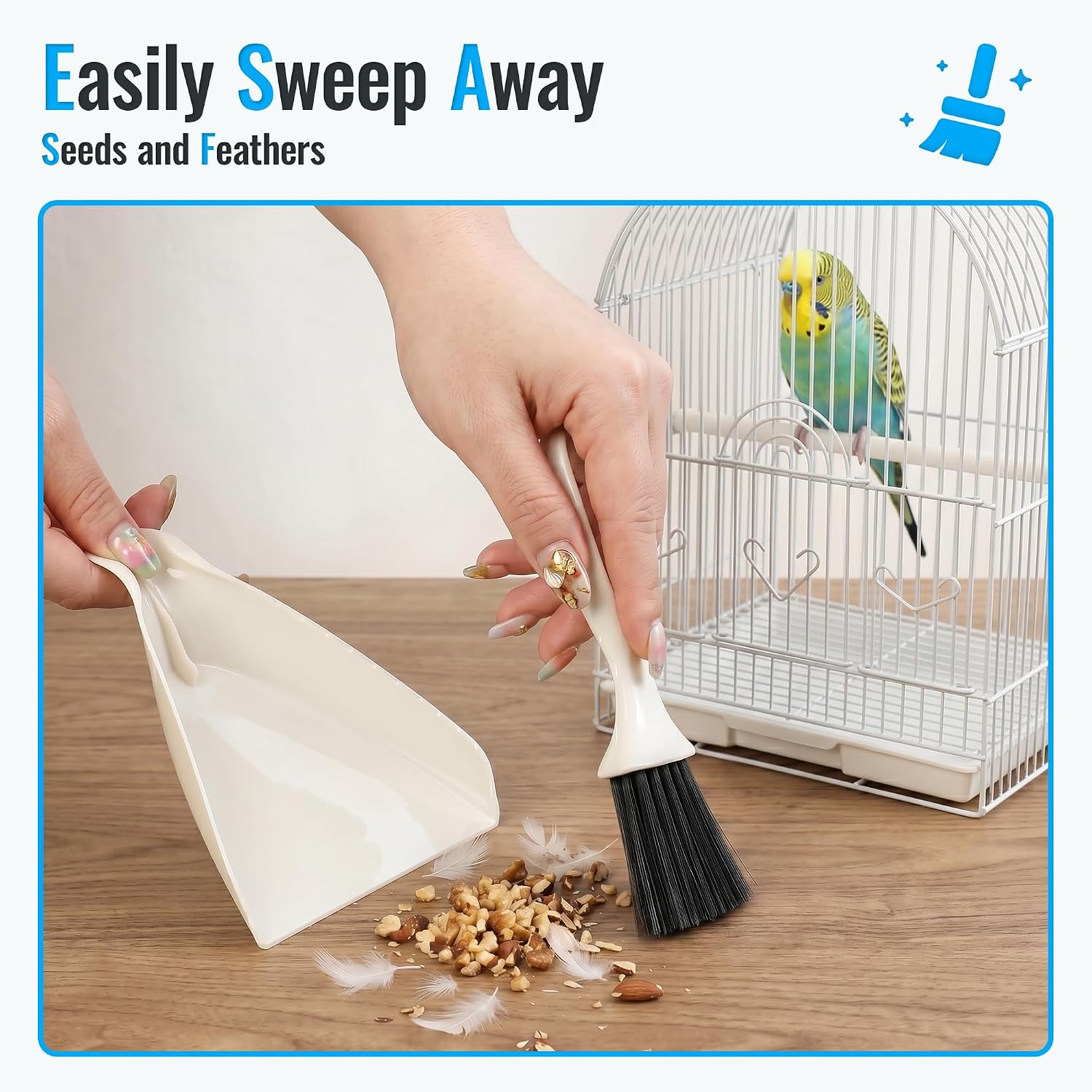 SIMPOR mini dustpan and hand brush sweeping up loose bird seeds and feathers.