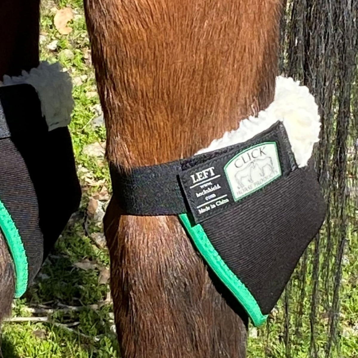 Pair of Intrepid International draft horse hock protectors laid out to show full coverage area.