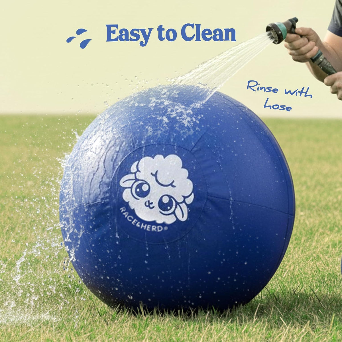 High drive dog pushing large blue herding ball in grass
