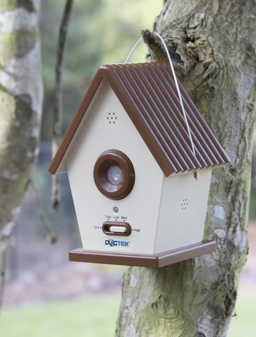 Dogtek ultrasonic birdhouse mounted on a tree outdoors