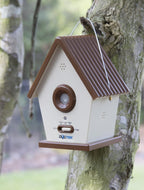 Dogtek ultrasonic birdhouse mounted on a tree outdoors