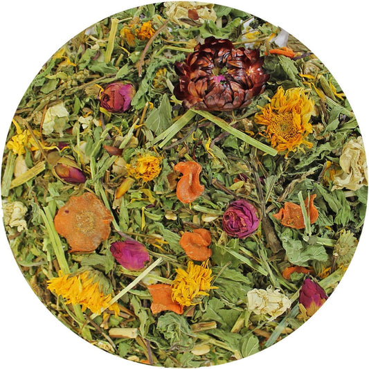 Close up view of the fourteen natural ingredients including dried marigold and dandelion petals inside the pet treat.