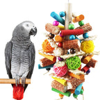 Kewkont Natural Peppered Wood Large Bird Toy front view hanging in a cage.