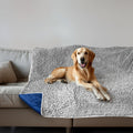 Muddy Mat dog blanket front view on a grey couch for water absorption