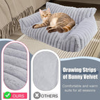 Cat resting comfortably on grey pet sofa